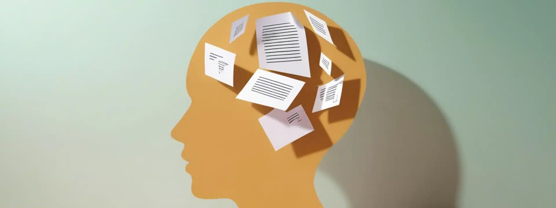 Silhouette of a human head with floating paper documents inside, symbolizing thoughts, mental overload, or information processing.