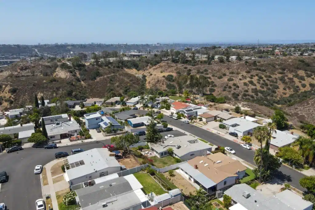 Aerial view of a residential neighborhood in Los Angeles, showcasing houses, streets, and greenery.